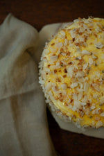 Load image into Gallery viewer, Coconut Cake with Passionfruit Curd
